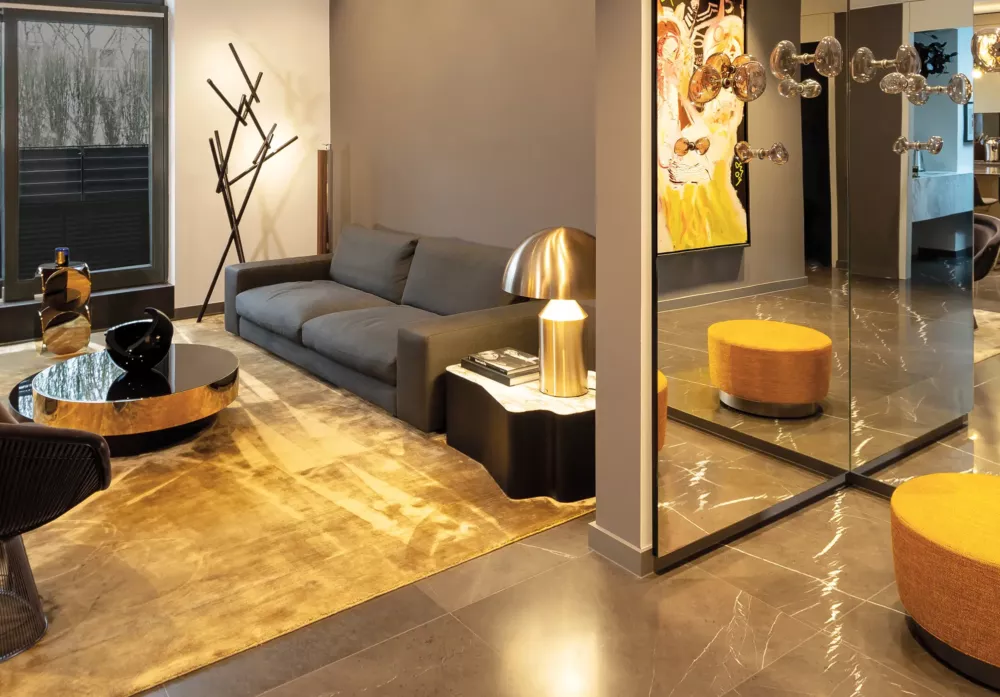 Exclusive living room in Private Penthouse Berlin featuring luxurious furnishings, gold accents, and modern design elements