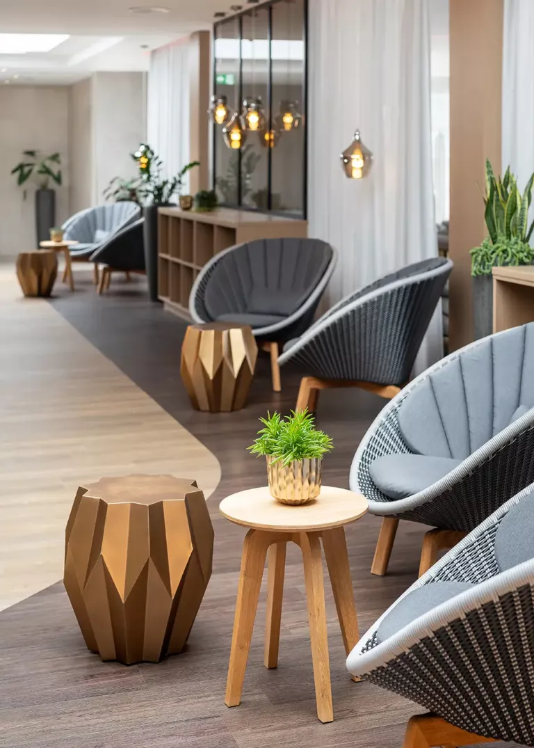 Premium relaxation area at Ostsee Therme Scharbeutz featuring stylish lounge chairs, designer side tables, and elegant lighting